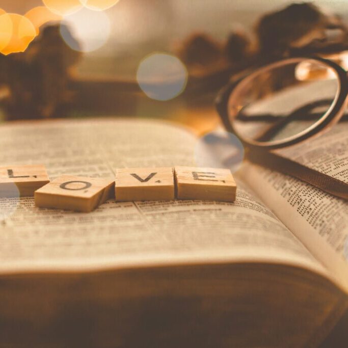 The sweet, sweet love of Jesus, Love scrabble tiles on book page